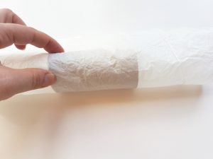 Rolling the tissue paper